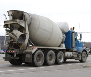 Cement truck driving on the highway.