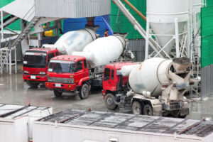 Concrete trucks refill ready for transport.