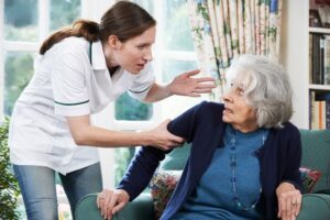 Senior in the nursing home feeling scared of her caretaker.