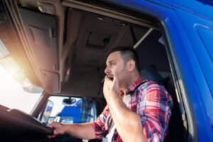 Featured image Fatigue truck driver feeling drowsy.