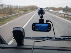 Featured image A high-tech dashboard camera mounted in an HGV (lorry truck), recording a clear view of the road during driving.