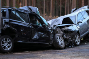Severe car crash happening along the highway.